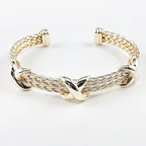 Double wire gold tone band with x marks brass bangle